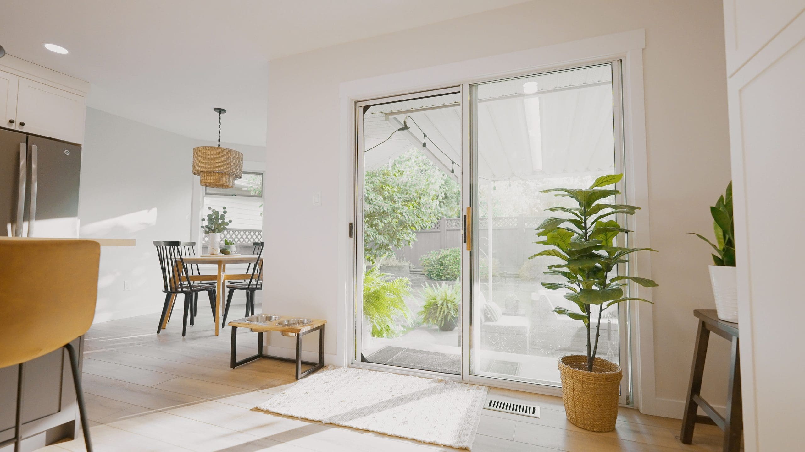 Living room sliding door with Phantom Screens looking out to backyard 