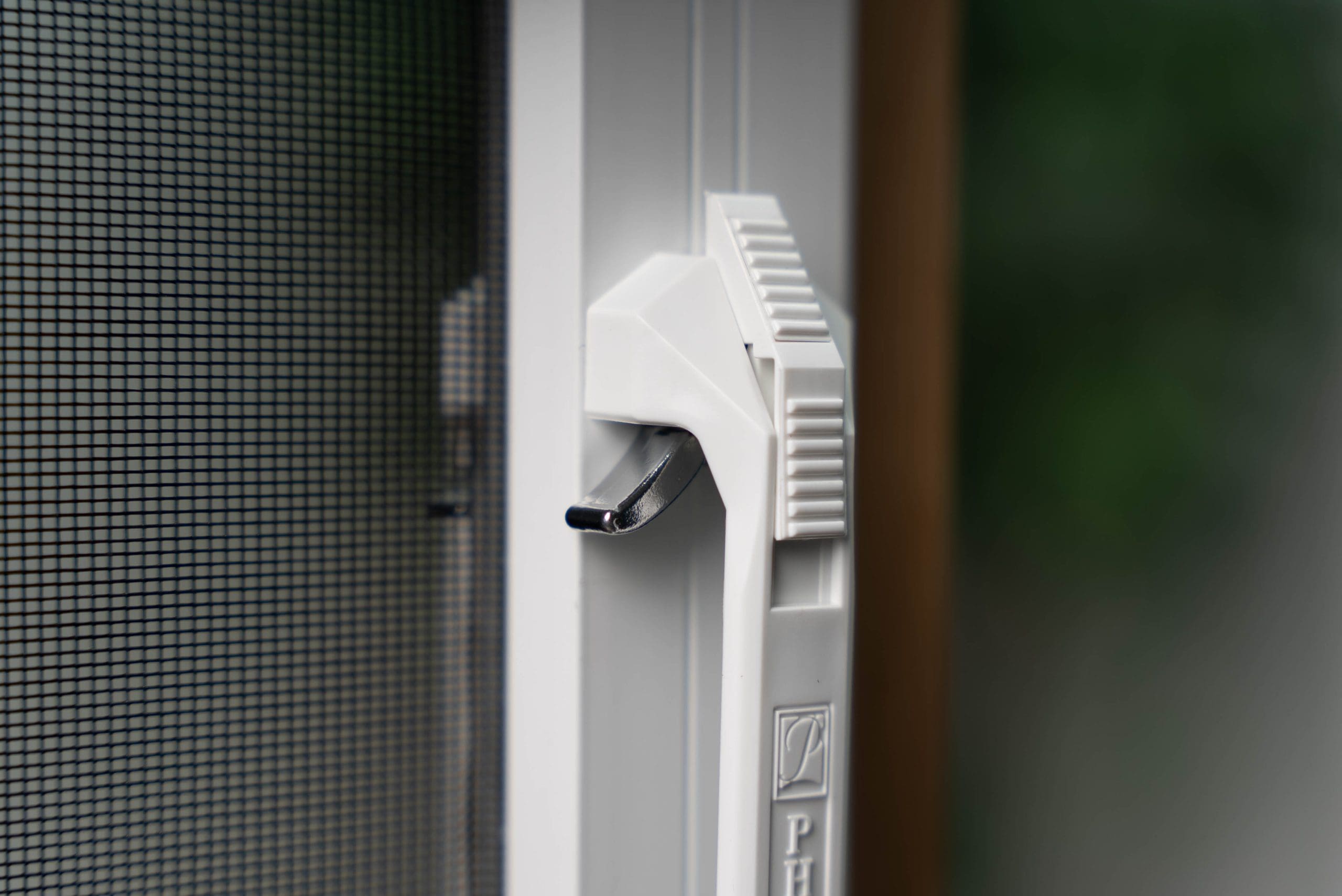 Close up of unlocked retractable door screen