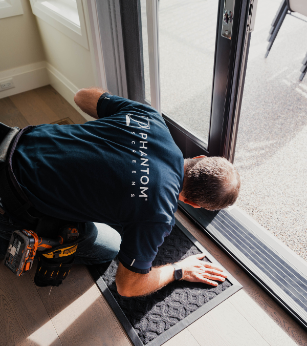 Phantom Screens distributor installing screen door