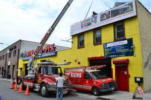 Erecting the Phantom Screens billboard in Brooklyn